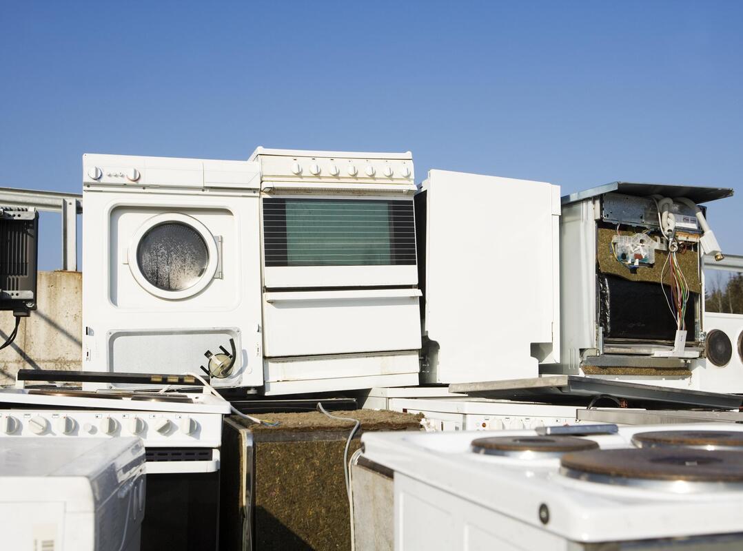 a junk yard of appliances 