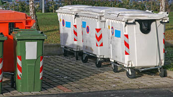 a row of trash container